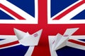 Great britain flag depicted on paper origami airplane and boat. Handmade arts concept Royalty Free Stock Photo