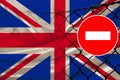 Great Britain flag, fence with barbed wire, symbolic red sign no entry, entry is prohibited, travel restrictions across European Royalty Free Stock Photo