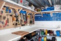 Workshop area in a home garage with organisation of tools and DIY equipment Royalty Free Stock Photo