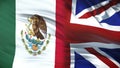 Great Britain and Mexica politicians exchanging top secret envelope against flag