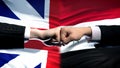 Great Britain vs Syria conflict, fists on flag background, diplomatic crisis Royalty Free Stock Photo