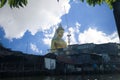 The Great Buddha against blue sky and old house at cannel in Bangkok Thailand Royalty Free Stock Photo