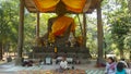 Great Buddha statue and small children begging donates in Angkor Wat Cambodia