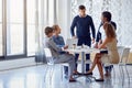 Great business ideas in the making. a team of businesspeople working on a laptop together at a table in the office. Royalty Free Stock Photo