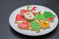 Great christmas background, christmas biscuits on white plate with black background