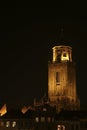 The Great Church and buildings in the City of Deventer, the Netherlands, at night with reflection in the water