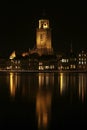 The Great Church and buildings in the City of Deventer, the Netherlands, at night with reflection in the water