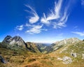 Great clear view in the mountain with beautiful clouds. Alps.