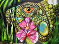 Colorful grafitti of a lizard with flower