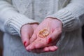 Great concept of divorce woman hand with two gold wedding rings in hand Royalty Free Stock Photo