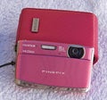Modern Fujifilm Finepix Z digital camera in rose Royalty Free Stock Photo
