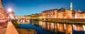 Great evening cityscape of Florence with Old Palace Palazzo Vecchio or Palazzo della Signoria on background and Ponte Vecchio Royalty Free Stock Photo