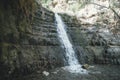 Great Falls Shulamit falls into  shallow pond with emerald water. Ein Gedi - Nature Reserve and National Park, Israel Royalty Free Stock Photo