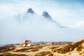 Great foggy view of the National park Tre Cime di Lavaredo. Location Dolomiti alps, Italy