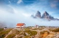 Great foggy view of the National park Tre Cime di Lavaredo. Location Dolomiti alps, Italy