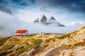 Great foggy view of the National park Tre Cime di Lavaredo. Location Dolomiti alps, Italy