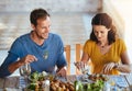 Great food, great company. a happy married couple enjoying lunch together outside. Royalty Free Stock Photo