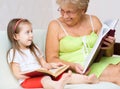 Great-grandmother reading a book Royalty Free Stock Photo