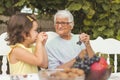 Great-grandmother spending time with her granddaughter outdoor