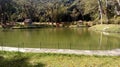 GREAT GREEN LAKE LOCATED AT THE ATLANTIC MATA FENCED WITH TREES AND PLANTS WITH PONTE CERCA AND CHILDREN`S CASINHAS, PETROPOLIS RI Royalty Free Stock Photo