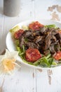 Salad with turkey liver, mushrooms and red oranges