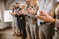 Successful business team is clapping their hands in modern workstation, celebrating the performance of new product Royalty Free Stock Photo