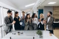 Great job! Successful business team is clapping their hands in modern workstation, celebrating the performance of new product Royalty Free Stock Photo