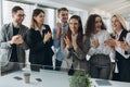 Great job! Successful business team is clapping their hands in modern workstation, celebrating the performance of new product Royalty Free Stock Photo