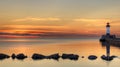 Great Lake Lighthouse Sunrise with Rocks Royalty Free Stock Photo