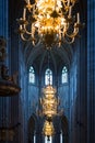 Great lamp with candles in church. Sweden, Europe