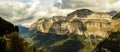 Great landscape with extensive forests and large limestone walls and cloudy sky. Ordesa Valley and walls of Mondarruego. Ordesa y Royalty Free Stock Photo