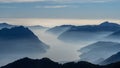 Great landscape at lake Iseo in winter season. Foggy and humidity in the air. Panorama from Monte Pora, Italian Alps, Italy Royalty Free Stock Photo