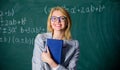 Great letter of recommendation. Woman smiling teacher hold book stand front chalkboard. Recommendation for college