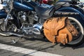 Great looking classic blue motorcycle with yellow leather saddlebags, lots of chrome parts and spoked wheels with white wall.