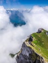 Great Majestic Dreamy Landscape View of Natural Swiss Alps from Mount Pilatus Peak. Breathtaking view of Steep Cliff and fog Royalty Free Stock Photo