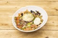 Great Mediterranean salad with lots of seasonings. Laminated boiled egg, canned tuna, goat cheese, Royalty Free Stock Photo