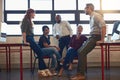 Great minds coming together. a group of designers having a discussion in an office.