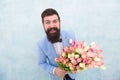 In great mood. bride groom at wedding party. bearded man in bow tie with tulip flowers. love date with flowers. Happy Royalty Free Stock Photo