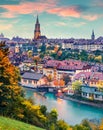 Great morning cityscape of Bern town with Cathedral of Bern on background. Gorgeous autumn sunrise in Switzerland, Aare River, Eur