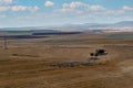 Great nature view, freshly mown crops and foggy mountains with clouds in the background. Emirdag, Turkey Royalty Free Stock Photo