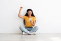 Great News. Happy Excited Young Woman Holding Smartphone And Celebrating Success Royalty Free Stock Photo