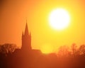 Great orange shot of sunset over church silhouette Royalty Free Stock Photo