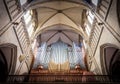 Great organ under arch in catholic church.