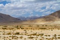 .Great Pamir Highway, desert landscape with sparse vegetation Royalty Free Stock Photo