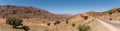 Great panoramic landscape of the Anti-Atlas mountains in the Taourirt region, a road winding through the mountains Royalty Free Stock Photo