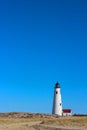 Great Point Light Lighthouse Nantucket with Blue Sky, Beach Grass and Dunes Royalty Free Stock Photo