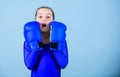 With great power comes great responsibility. Boxer child in boxing gloves. Female boxer change attitudes within sport