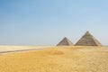The Great Pyramid also known as Cheops pyramid or Khufu and the pyramid of Khafre or Chefren at Giza pyramid complex, Egypt Royalty Free Stock Photo