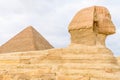 The great pyramid of Cheops and Sphinx in Giza plateau. Cairo, Egypt Royalty Free Stock Photo