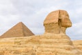 The great pyramid of Cheops and Sphinx in Giza plateau. Cairo, Egypt Royalty Free Stock Photo